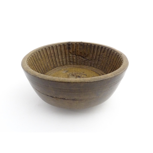 1180 - Treen : A 19thC sycamore flummery / pudding bowl / mould of circular form, having an interior with v... 