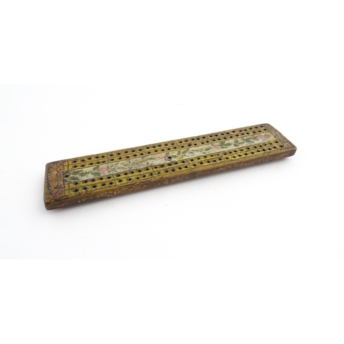 1181 - Treen : An 18thC naive cribbage board with hand painted decoration. Approx. 8