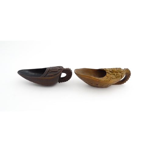 1183 - Treen : Two 19thC treen pap boats with carved floral and foliate decoration. Largest approx. 5 1/2