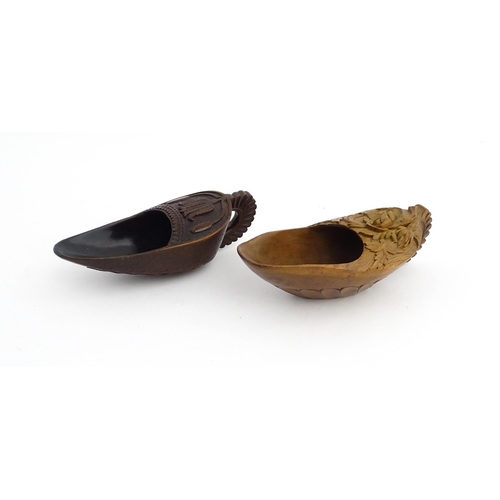 1183 - Treen : Two 19thC treen pap boats with carved floral and foliate decoration. Largest approx. 5 1/2