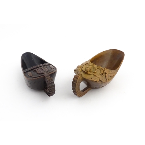 1183 - Treen : Two 19thC treen pap boats with carved floral and foliate decoration. Largest approx. 5 1/2