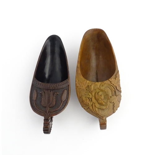 1183 - Treen : Two 19thC treen pap boats with carved floral and foliate decoration. Largest approx. 5 1/2