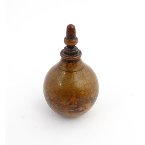 1184 - Treen : A 19thC treen spice flask shaped form, the acorn finial unscrewing to reveal a five hole sha... 