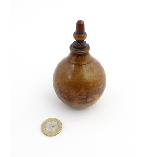 1184 - Treen : A 19thC treen spice flask shaped form, the acorn finial unscrewing to reveal a five hole sha... 