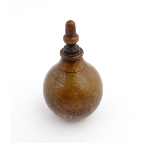 1184 - Treen : A 19thC treen spice flask shaped form, the acorn finial unscrewing to reveal a five hole sha... 