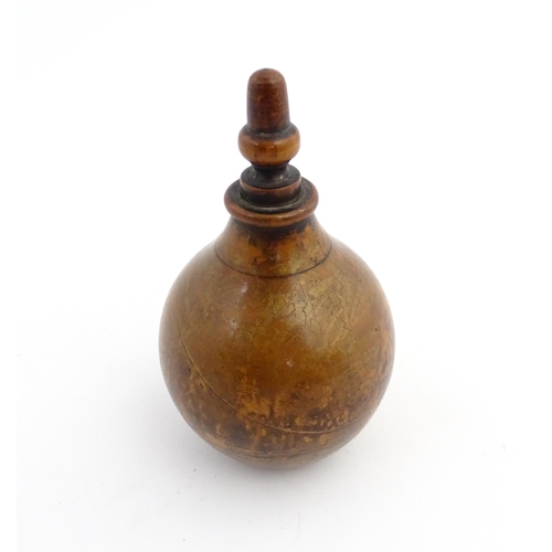 1184 - Treen : A 19thC treen spice flask shaped form, the acorn finial unscrewing to reveal a five hole sha... 