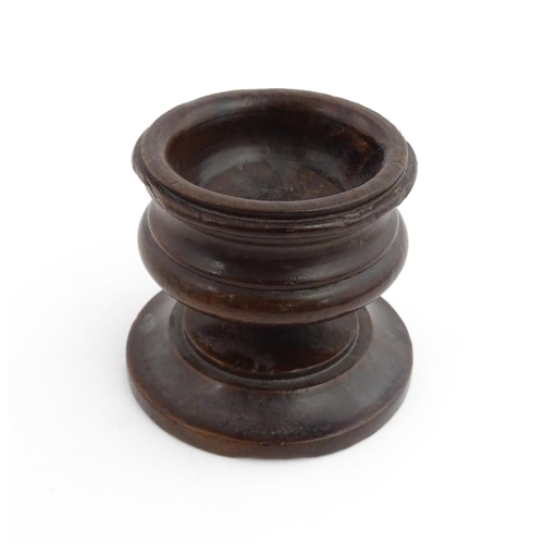 1189 - Treen : An 18thC turned wooden pedestal salt of squat form. From the P. B. Wacher Collection, label ... 