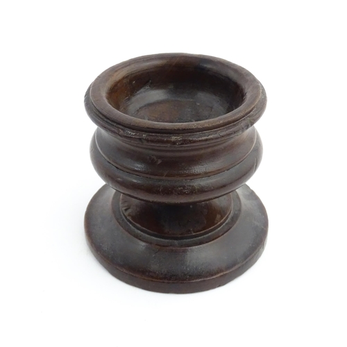 1189 - Treen : An 18thC turned wooden pedestal salt of squat form. From the P. B. Wacher Collection, label ... 