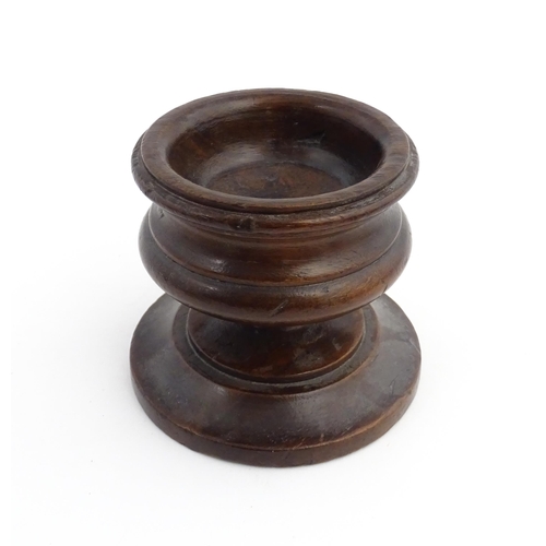 1189 - Treen : An 18thC turned wooden pedestal salt of squat form. From the P. B. Wacher Collection, label ... 