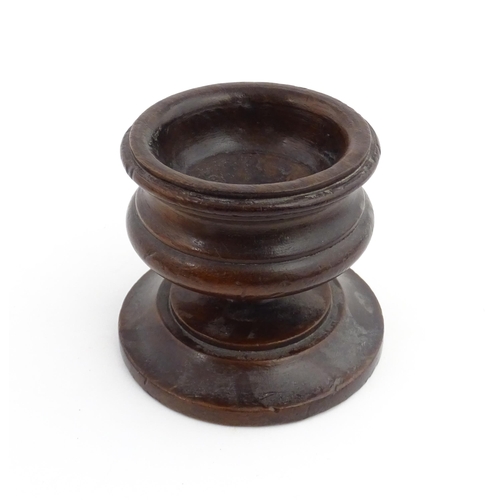 1189 - Treen : An 18thC turned wooden pedestal salt of squat form. From the P. B. Wacher Collection, label ... 