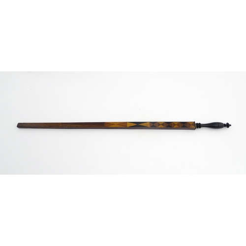 1192 - Treen : A late 18th / early 19thC mahogany ell rule / measuring stick with turned handle and geometr... 