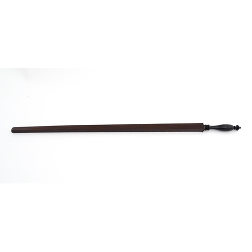 1192 - Treen : A late 18th / early 19thC mahogany ell rule / measuring stick with turned handle and geometr... 