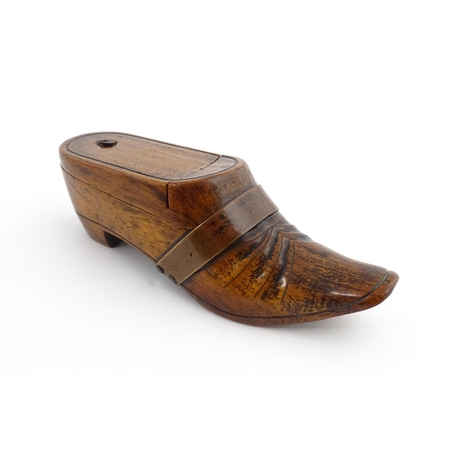 1195 - Treen : A 19thC treen novelty puzzle snuff box modelled as a shoe with copper band detail. Approx. 5... 