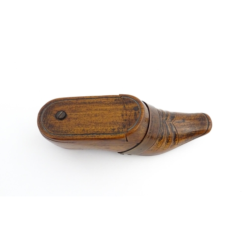 1195 - Treen : A 19thC treen novelty puzzle snuff box modelled as a shoe with copper band detail. Approx. 5... 