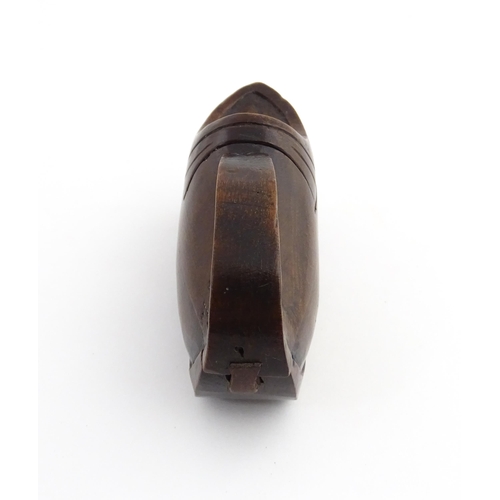 1196 - Treen : A 19thC Continental novelty puzzle snuff box modelled as a shoe with heart detail. Approx. 3... 