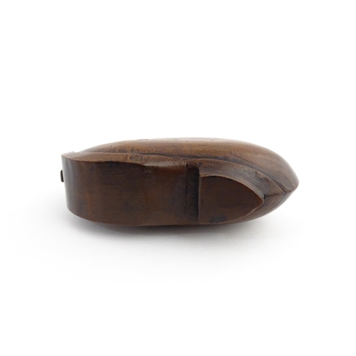 1196 - Treen : A 19thC Continental novelty puzzle snuff box modelled as a shoe with heart detail. Approx. 3... 