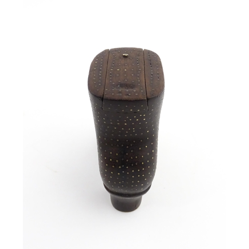 1197 - Treen : A carved shoe snuff box modelled as a heeled boot with sliding top and inlaid brass detail. ... 