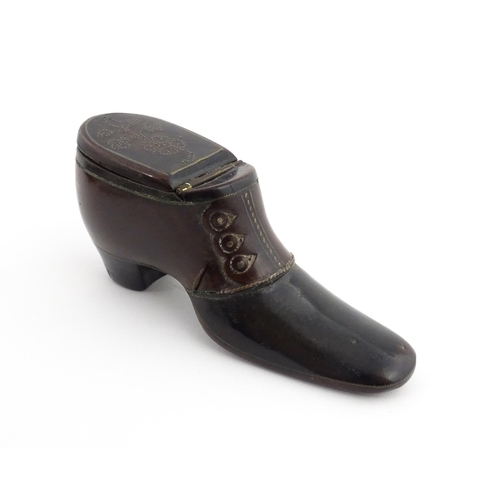 1198 - Treen : A carved snuff box modelled as a  heeled shoe with hinged lid and inlaid brass detail. Appro... 