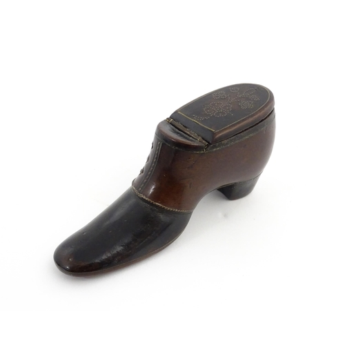 1198 - Treen : A carved snuff box modelled as a  heeled shoe with hinged lid and inlaid brass detail. Appro... 