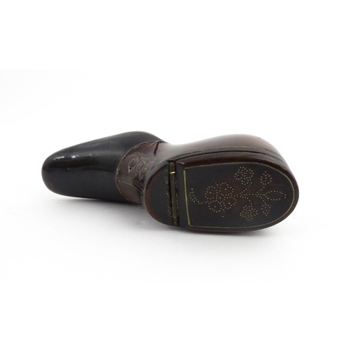 1198 - Treen : A carved snuff box modelled as a  heeled shoe with hinged lid and inlaid brass detail. Appro... 