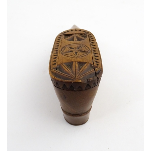 1199 - Treen : A 19thC Dutch snuff box of shoe form with sliding top and chip carved decoration. Approx. 4 ... 