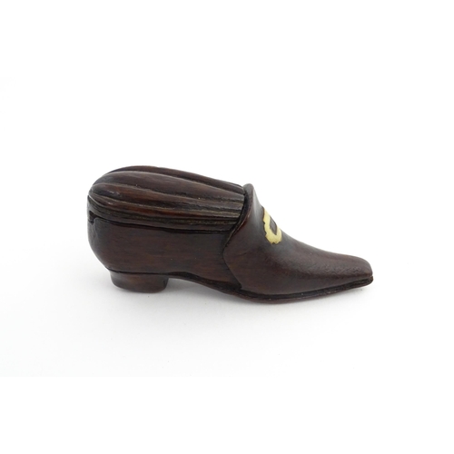 1201 - Treen : A 19thC snuff box modelled as a shoe with sliding top and carved detail. Approx. 3 1/2