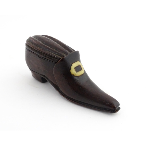 1201 - Treen : A 19thC snuff box modelled as a shoe with sliding top and carved detail. Approx. 3 1/2