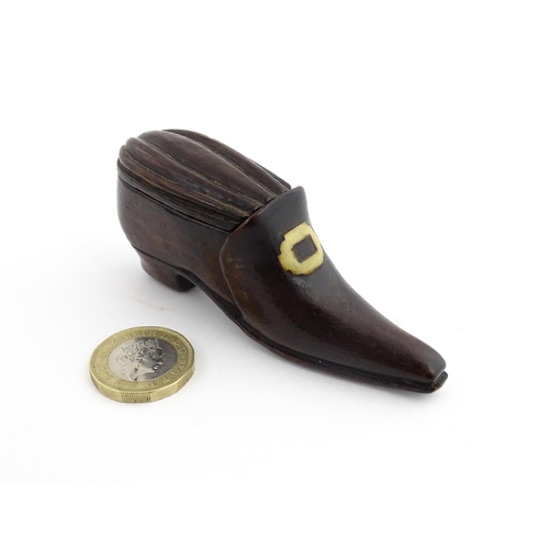 1201 - Treen : A 19thC snuff box modelled as a shoe with sliding top and carved detail. Approx. 3 1/2