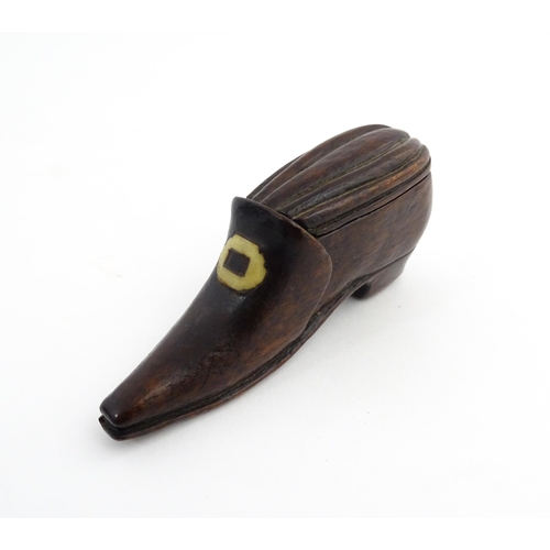 1201 - Treen : A 19thC snuff box modelled as a shoe with sliding top and carved detail. Approx. 3 1/2