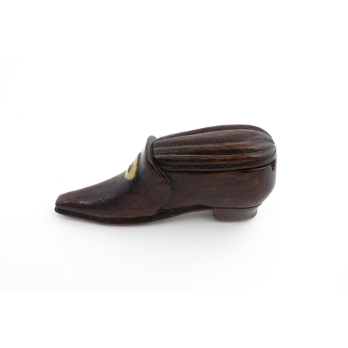 1201 - Treen : A 19thC snuff box modelled as a shoe with sliding top and carved detail. Approx. 3 1/2