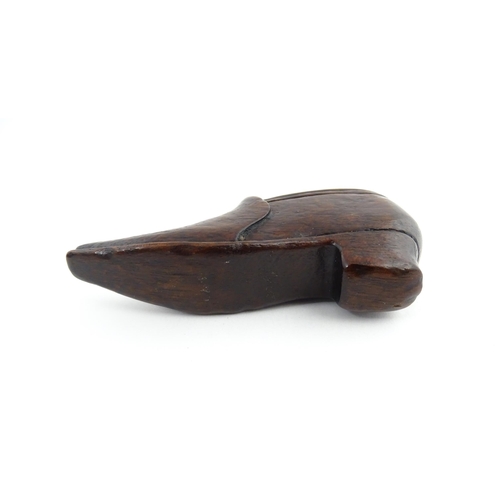 1201 - Treen : A 19thC snuff box modelled as a shoe with sliding top and carved detail. Approx. 3 1/2