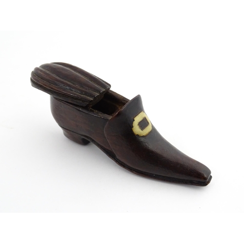 1201 - Treen : A 19thC snuff box modelled as a shoe with sliding top and carved detail. Approx. 3 1/2