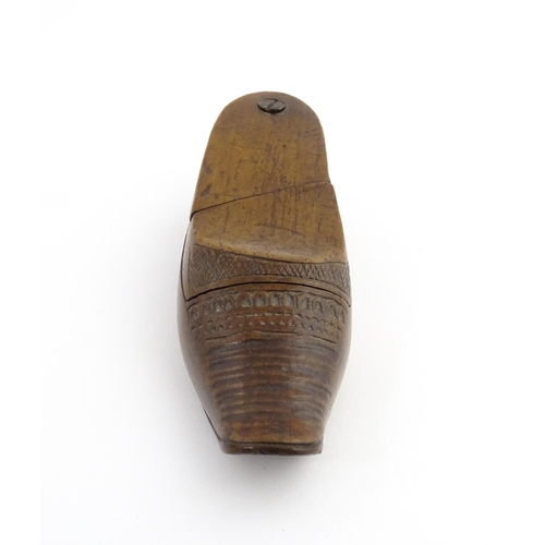 1202 - Treen : A 19thC Dutch novelty puzzle snuff box modelled as a shoe with carved decoration. Approx. 3 ... 