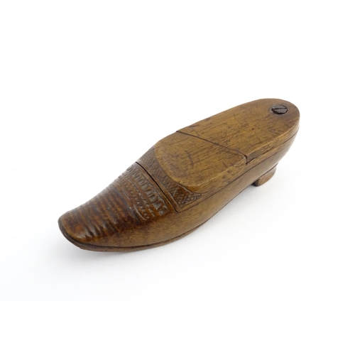 1202 - Treen : A 19thC Dutch novelty puzzle snuff box modelled as a shoe with carved decoration. Approx. 3 ... 