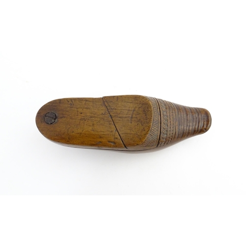 1202 - Treen : A 19thC Dutch novelty puzzle snuff box modelled as a shoe with carved decoration. Approx. 3 ... 