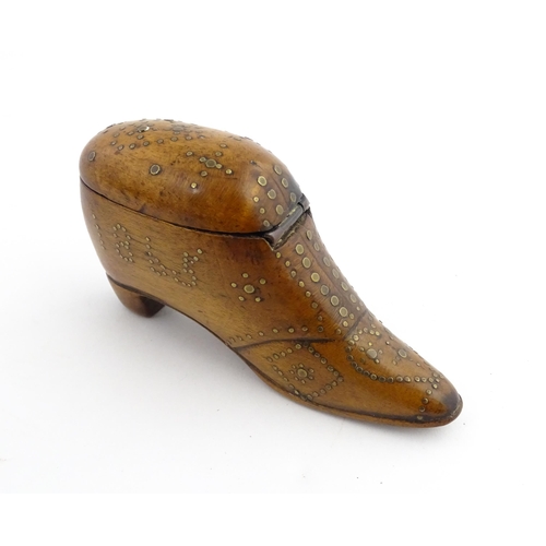 1204 - Treen : A 19thC snuff box modelled as a shoe with hinged top and inlaid brass detail, dated 1865. Ap... 