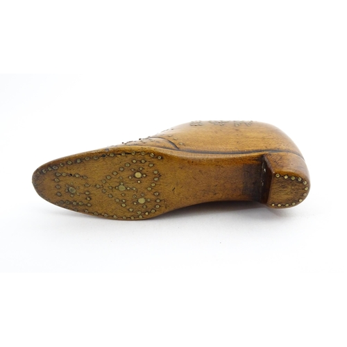 1204 - Treen : A 19thC snuff box modelled as a shoe with hinged top and inlaid brass detail, dated 1865. Ap... 