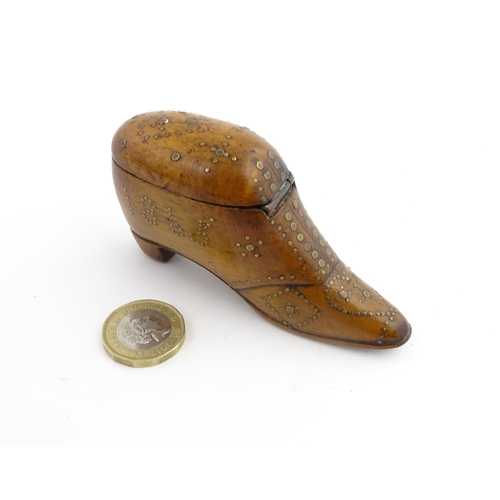 1204 - Treen : A 19thC snuff box modelled as a shoe with hinged top and inlaid brass detail, dated 1865. Ap... 