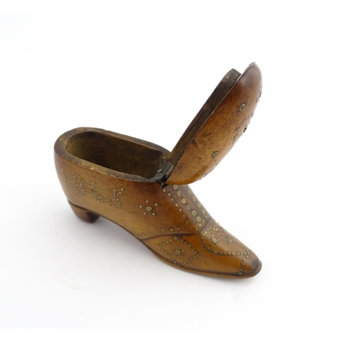 1204 - Treen : A 19thC snuff box modelled as a shoe with hinged top and inlaid brass detail, dated 1865. Ap... 