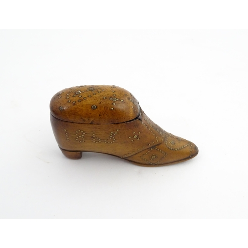 1204 - Treen : A 19thC snuff box modelled as a shoe with hinged top and inlaid brass detail, dated 1865. Ap... 