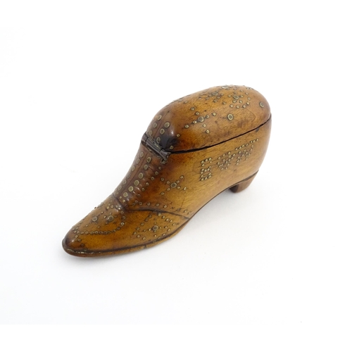 1204 - Treen : A 19thC snuff box modelled as a shoe with hinged top and inlaid brass detail, dated 1865. Ap... 