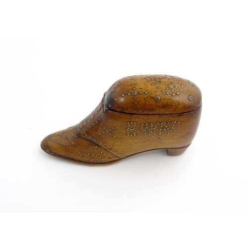 1204 - Treen : A 19thC snuff box modelled as a shoe with hinged top and inlaid brass detail, dated 1865. Ap... 