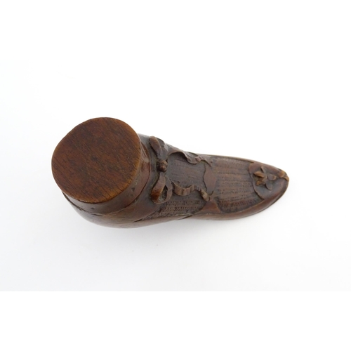 1205 - Treen : A 19thC shoe snuff box modelled as a ladies shoe with carved bow and flower detail. Approx. ... 