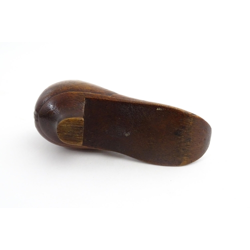 1205 - Treen : A 19thC shoe snuff box modelled as a ladies shoe with carved bow and flower detail. Approx. ... 