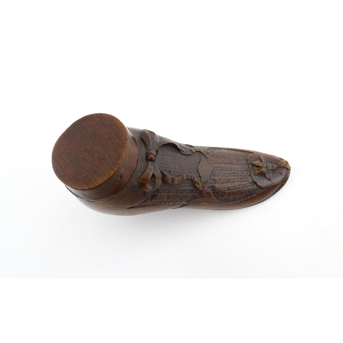 1205 - Treen : A 19thC shoe snuff box modelled as a ladies shoe with carved bow and flower detail. Approx. ... 