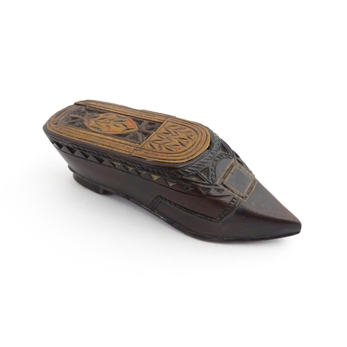 1206 - Treen : A 19thC Continental shoe snuff box with sliding top, chip carved decoration and painted deta... 