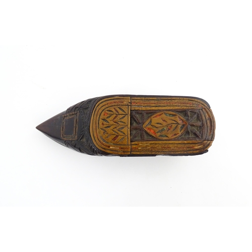 1206 - Treen : A 19thC Continental shoe snuff box with sliding top, chip carved decoration and painted deta... 