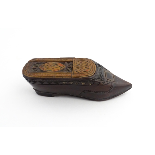 1206 - Treen : A 19thC Continental shoe snuff box with sliding top, chip carved decoration and painted deta... 