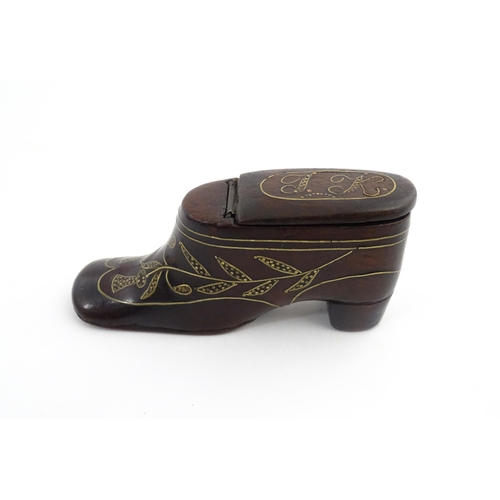 1207 - Treen : A 19thC shoe snuff box modelled as a heeled shoe with hinged top and inlaid thistle decorati... 