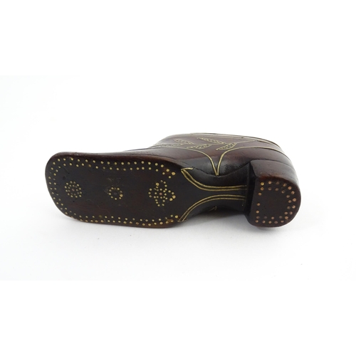 1207 - Treen : A 19thC shoe snuff box modelled as a heeled shoe with hinged top and inlaid thistle decorati... 